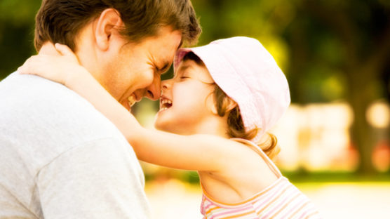 father and daughter smiling because the best Father's day gift is one from Omaha Steaks