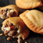 filet mignon empanadas sliced open on serving platter