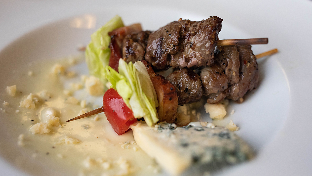 blt steak skewers plated with blue cheese dressing