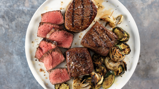 top sirloin, filet mignon and brussels sprouts plated