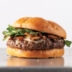 Delmonico burger with havarti cheese, marinated mushrooms and fresh arugula