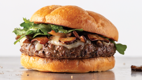 Delmonico burger with marinated mushrooms, havarti cheese and arugula