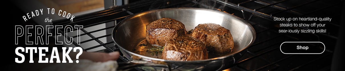 Three steaks sear in a skillet on a grill, with text promoting the perfect steak and shopping for premium steaks.