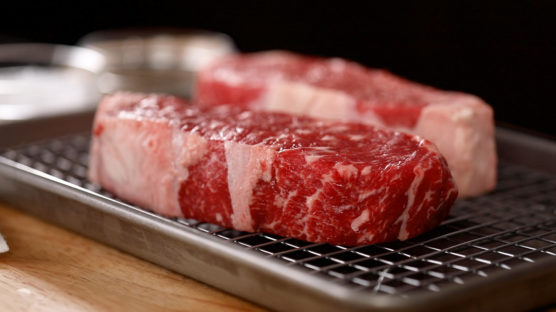 NY strip steak on baking rack