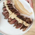Plated steak au poivre on new york strip steak