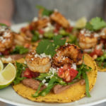 grilled shrimp tostadas on a white plate