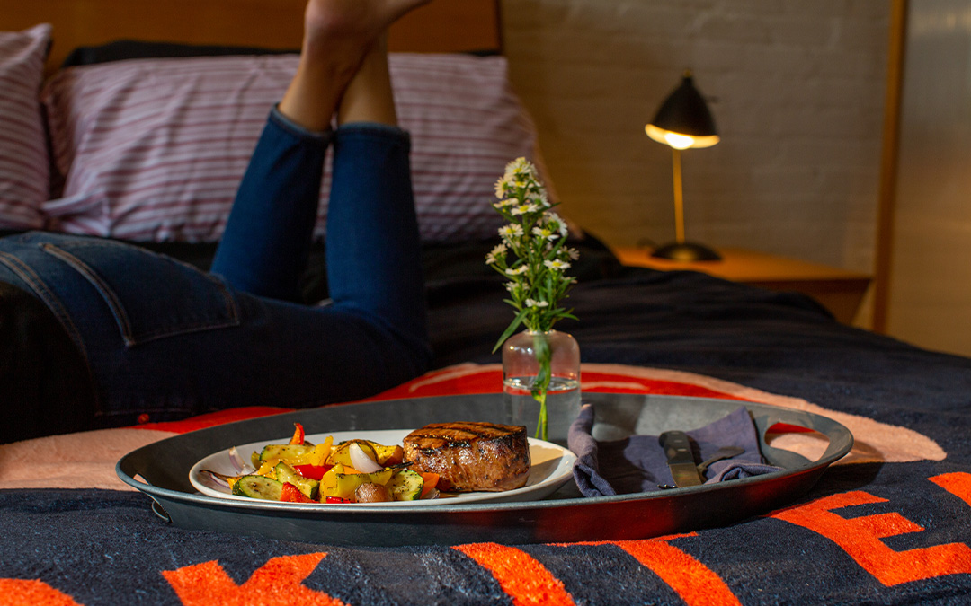 Steak dinner at Omaha Steaks Steakation The Ultimate Vacation Now Exists – Steak Fans Can Stay in a Meat Suite for a ‘Steakation’