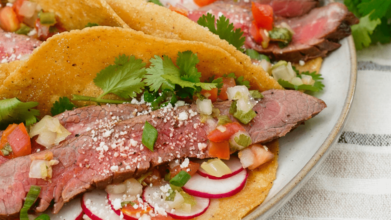 easy air fryer recipes Tacos with sliced flank steak, sliced radishes, cilantro and salsa