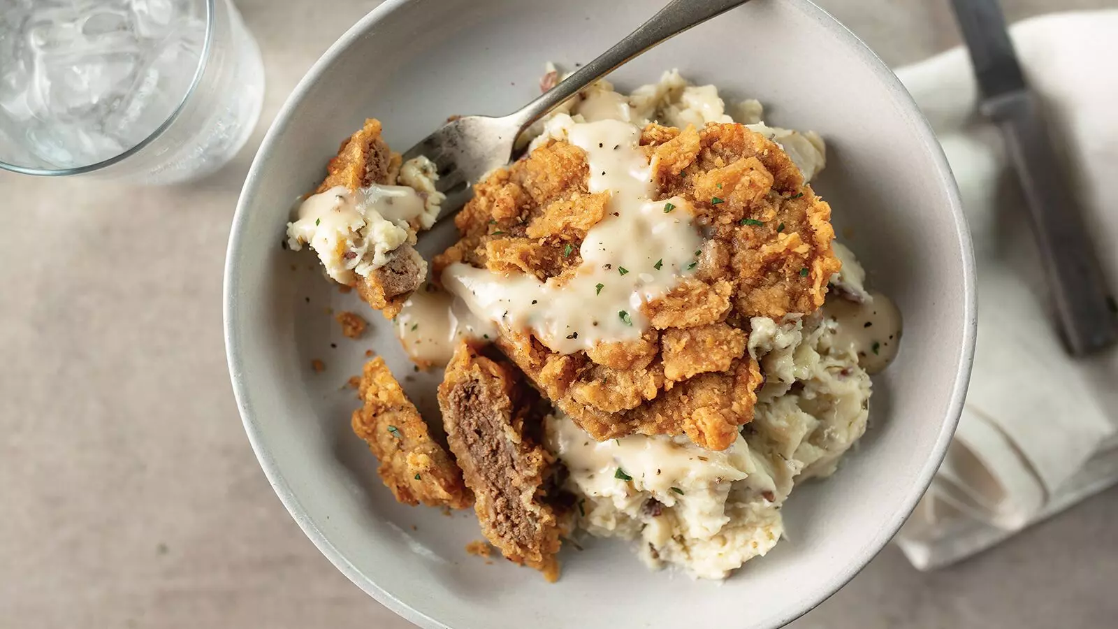 Chicken Fried Steak with Mashed Potatoes and Peppered Cream Gravy