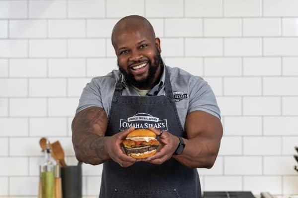 https://www.omahasteaks.com/blog/wp-content/uploads/2023/03/chef-david-rose-holding-italian-stallion-burger-600x400-1.jpg