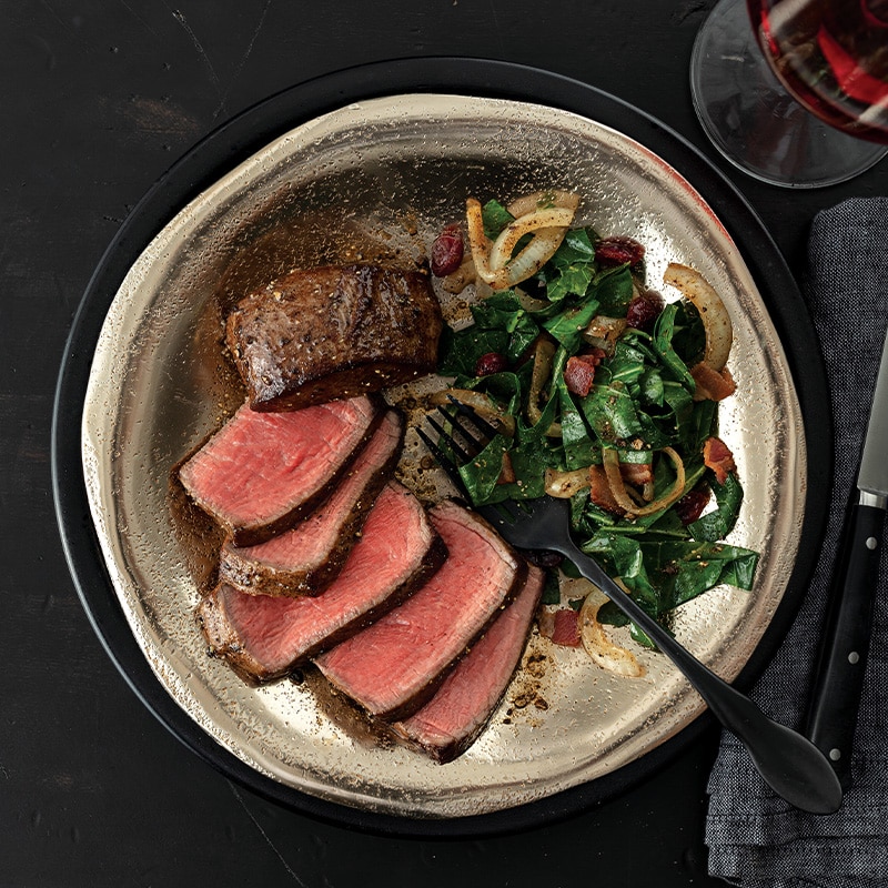 filet mignon and vegetables on white plate filet mignon and vegetables on white plate
