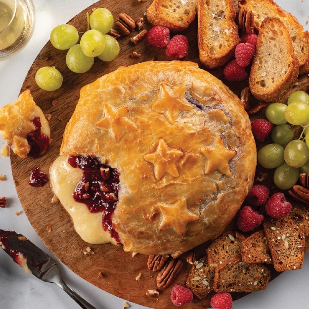 Baked Brie en Croute on wooden plate