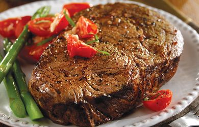 Ribeye Steaks with Sauteed Grape Tomatoes and Brie